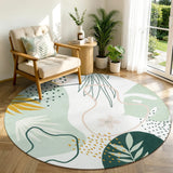 Covaba modern botanical leaf round rug in fern green, styled in a room setting, view 2
