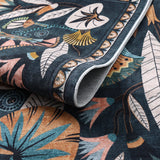 Covaba egyptian-inspired botanical rug in deep navy, styled in a room setting, view 2