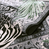 Covaba wild tiger rug in ink black, styled in a room setting, view 2