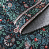 Covaba vintage floral bird royal rug in stormy blue, styled in a room setting