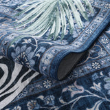 Covaba wild tiger rug in stormy blue, styled in a room setting, view 2