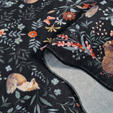 Covaba maximalist unicorn garden scalloped rug in ink black, styled in a room setting, view 2
