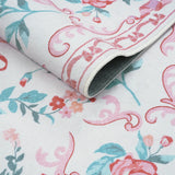Covaba floral bows rug in blush clay, styled in a room setting, view 2