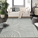 Covaba abstract rainbow stripe black/beige area rug in warm beige, styled in a room setting, view 4