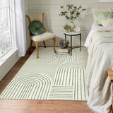 Covaba abstract rainbow stripe green/white area rug in fern green, styled in a room setting, view 2