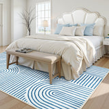 Covaba abstract rainbow stripe blue/white area rug in stormy blue, styled in a room setting, view 7