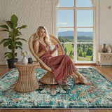 Covaba bohemian floral medallion area rug in teal haze, styled in a room setting, view 7