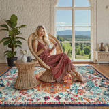 Covaba bohemian floral medallion area rug in amber clay, styled in a room setting, view 16