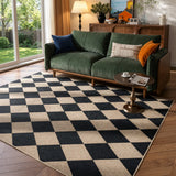 Covaba geometric checkered easy jute indoor/outdoor area rug in ink black, styled in a room setting, view 6