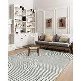 Covaba abstract rainbow stripe black/beige area rug in warm beige, shown flat on a plain ivory backdrop, view 3