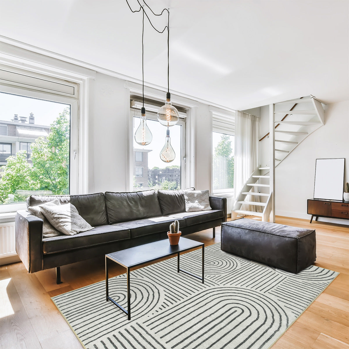 Covaba abstract rainbow stripe black/beige area rug in warm beige, styled in a room setting