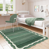 Covaba modern abstract bordered scalloped area rug in fern green, styled in a room setting, view 3