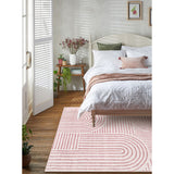 Covaba abstract rainbow stripe pink/white area rug in blush clay, shown flat on a plain ivory backdrop, view 4