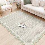 Covaba modern abstract bordered scalloped area rug in warm beige, styled in a room setting, view 2
