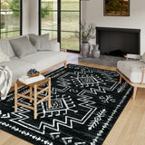 Covaba aztec moroccan distressed area rug in ink black, styled in a room setting, view 4