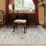 Covaba boho modern parisian garden floral area rug in muted plum, styled in a room setting, view 11