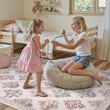 Covaba meadow floral area rug in blush clay, styled in a room setting, view 8