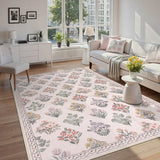 Covaba meadow floral area rug in blush clay, styled in a room setting, view 6
