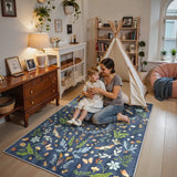 Covaba boho insect botanical floral area rug in stormy blue, styled in a room setting, view 7
