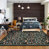 Covaba maximalism vibrant blossom floral area rug in ink black, styled in a room setting, view 5