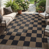 Covaba checkered easy jute indoor/outdoor area rug in coffee brown, styled in a room setting, view 8