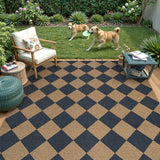 Covaba geometric checkered easy jute indoor/outdoor area rug in stormy blue, styled in a room setting, view 2
