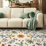 Covaba boho botanical floral area rug in warm beige, styled in a room setting, view 3