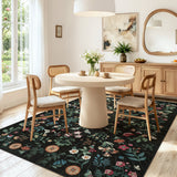 Covaba boho botanical floral area rug in ink black, styled in a room setting, view 8
