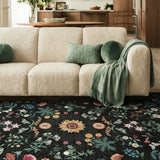 Covaba boho botanical floral area rug in ink black, styled in a room setting, view 4