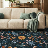 Covaba boho botanical floral area rug in stormy blue, styled in a room setting, view 3