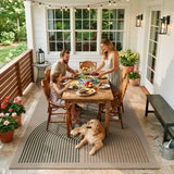 Covaba rainbow easy jute black/beige indoor/outdoor area rug in warm beige, styled in a room setting, view 5