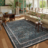 Covaba maximalism vintage french floral area rug in ink black, styled in a room setting