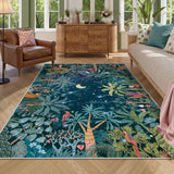 Covaba jungle midnight area rug in stormy blue, styled in a room setting, view 3