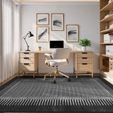 Covaba modern minimalist line area rug in ink black, styled in a room setting, view 4