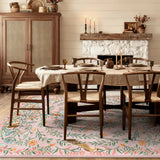 Covaba fantasy garden and unicorn area rug in blush clay, styled in a room setting, view 5