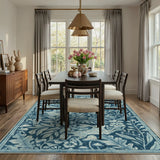 Covaba vintage woodcut forest and rabbit area rug in stormy blue, styled in a room setting, view 11