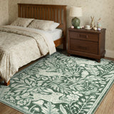 Covaba vintage woodcut forest and rabbit area rug in fern green, styled in a room setting, view 3