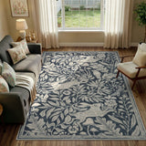 Covaba vintage woodcut forest and rabbit area rug in pearl grey, styled in a room setting, view 2