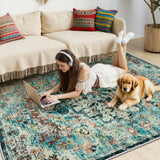 Covaba bohemian floral medallion area rug in teal haze, styled in a room setting, view 10