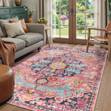 Covaba bohemian floral medallion area rug in faded rose, styled in a room setting, view 3