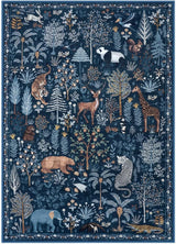 Covaba jungle animals area rug in deep navy, styled in a room setting