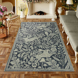 Covaba vintage woodcut forest and rabbit area rug in pearl grey, styled in a room setting