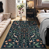 Covaba boho insect botanical floral area rug in ink black, styled in a room setting, view 3