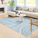 Covaba abstract rainbow stripe blue/white area rug in stormy blue, styled in a room setting