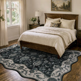 Covaba vintage botanical scalloped area rug in ink black, styled in a room setting, view 7