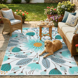 Covaba floral indoor outdoor area rug in stormy blue, styled in a room setting, view 2