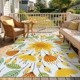 Covaba floral indoor outdoor area rug in golden wheat, styled in a room setting, view 3