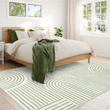Covaba abstract rainbow stripe green/white area rug in fern green, styled in a room setting, view 5