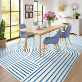 Covaba abstract rainbow stripe blue/white area rug in stormy blue, styled in a room setting, view 3
