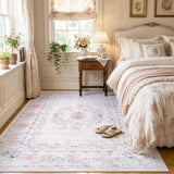 Covaba vintage traditional floral area rug in blush clay, styled in a room setting, view 12